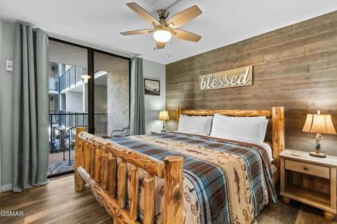 Bedroom with king bed balcony access and TV (sleeps 2)