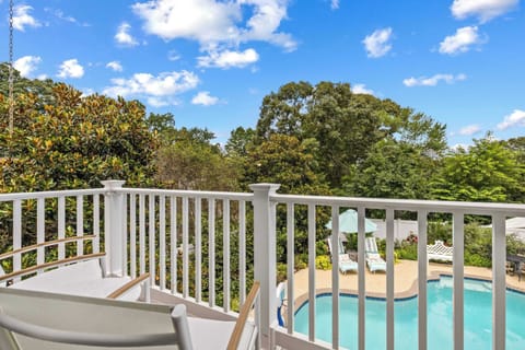 Sunny balcony overlooking the pool, perfect for morning coffee