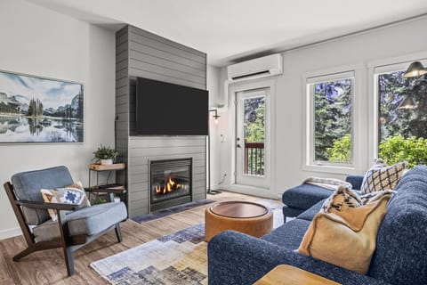 Spacious modern living room. Complete privacy surrounded with beautiful trees, south facing natural light and iconic mountains peaking through