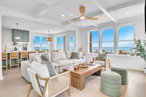 Beautiful living area with water views, large windows, and open layout