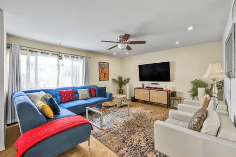 Stylish living room with large smart TV and spacious sectional sofa