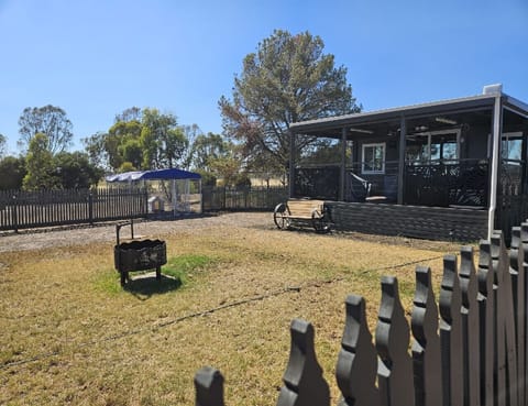 Fully Fenced yard with dog cage if required