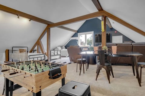 3rd room with games, large tv and comfy seating throughout