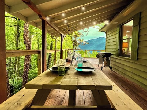 Covered deck includes flattop grill, picnic table, and great mountain views.