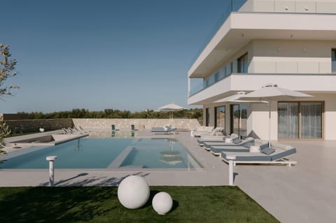 Calòre Villa - designed for multigenerational escapes and summer serenity.