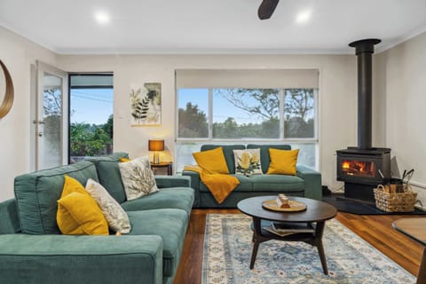 Light filled open plan living area with stylish mid century inspired furnishings