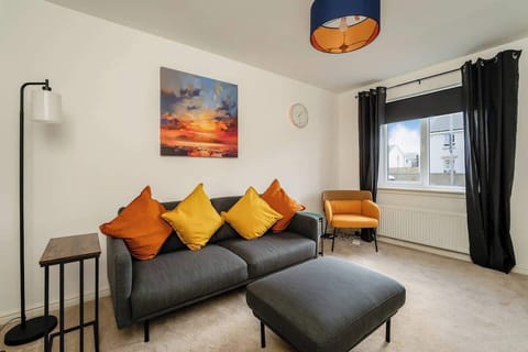 Cozy, bright, and airy living room with comfortable seating. Perfect for relaxing and unwinding.