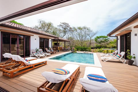 Sun loungers by the poolside - The three step front area is perfect for smaller kids or older adults to wade into the water