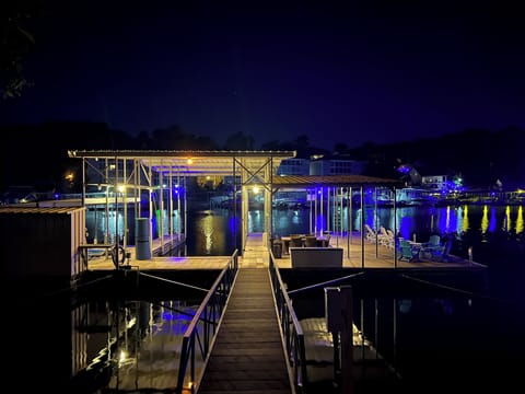 Well lit dock.  Shimmering lights are beautiful and peaceful