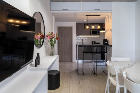 Apartment, 1 Bedroom, Balcony, City View | Living area | 40-inch Smart TV with cable channels, Netflix, DVD player