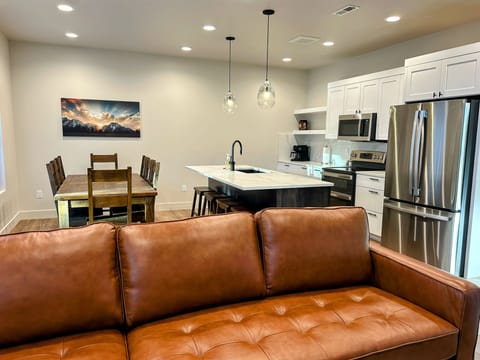 modern living room offers comfy seating, cozy fireplace, and a SmartTV