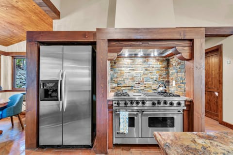 Kitchen: Main floor, drip coffee maker, toaster, blender, cooking utensils, tableware