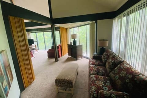 Gather with family or friends in the inviting living area of this charming treetop retreat.