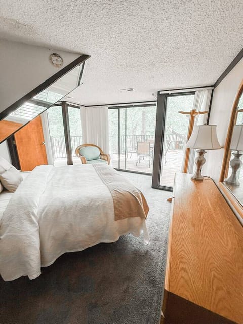 Inviting room with direct deck access, perfect for spontaneous nighttime lounging under the stars with friends and family.