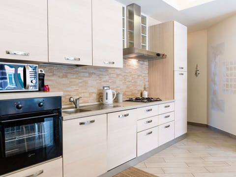 Kitchen, Cabinetry, Countertop, Kitchen Appliance, Major Appliance, Wood, Furniture, Interior Design, Flooring, Cupboard