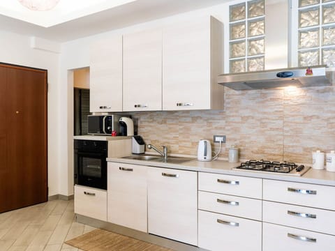 Kitchen, Countertop, Cabinetry, Kitchen Appliance, Major Appliance, Furniture, Wood, Flooring, Interior Design, Home