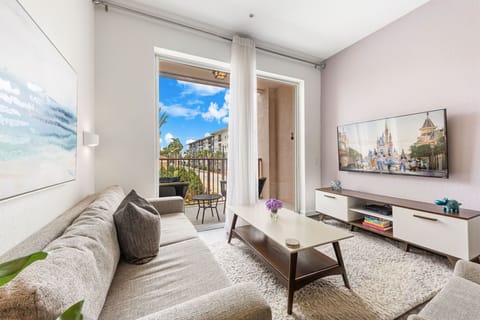 An open living area with a cozy sofa and a Smart TV