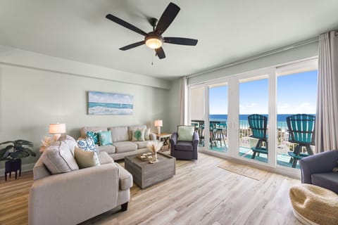 Relax in this modern living room with ocean views and direct balcony access.