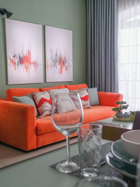 The heart of the living room, our notorious orange couch