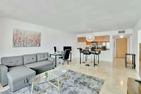 Spacious living area with cozy seating and smart TV - perfect for relaxing or streaming your favorites.
