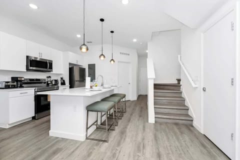Modern kitchen stocked with all the essentials, ready for home-cooked meals.