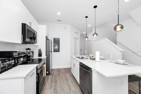 Modern kitchen stocked with all the essentials, ready for home-cooked meals.