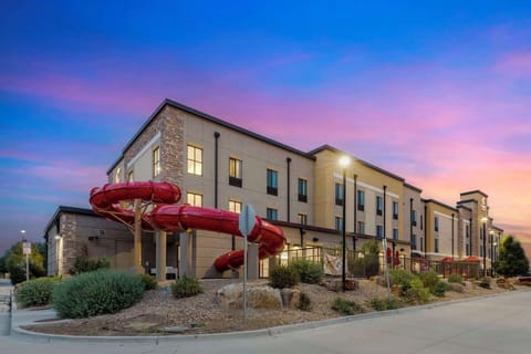 Arrive at sunset to a welcoming hotel with waterslide fun.