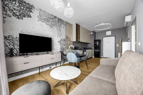 Living Room with Sofa Bed, Smart TV and Dining Table | Book Now with RENTUJEMY.COM