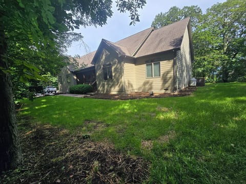 Font yard. Grass is starting to come in! Large and lit walkway up to the door.