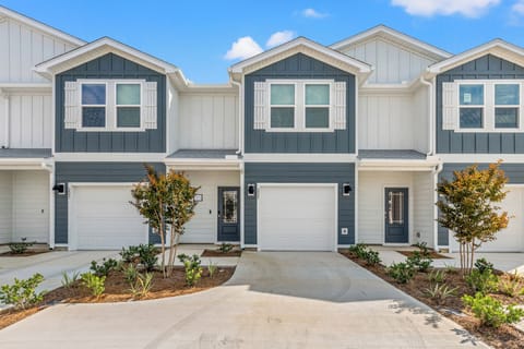 Charming home exterior with modern beach style and free parking