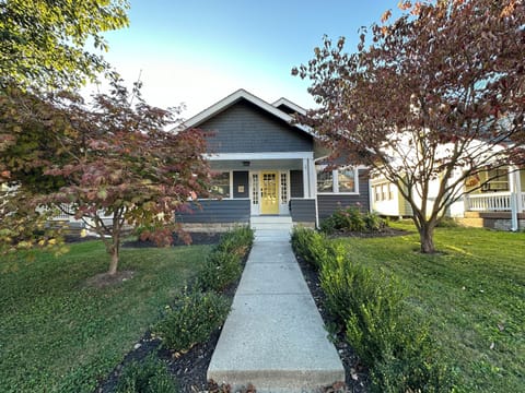 1915 Broad Ripple bungalow with front porch seating.