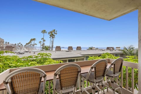 Relax on the balcony and take in stunning ocean views, seating for all guests.