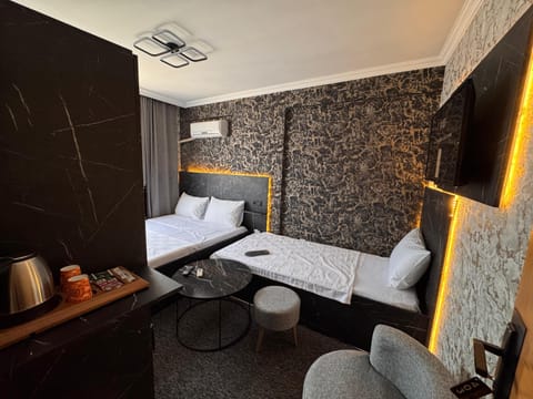 Family Triple Room | Desk, laptop workspace, free WiFi, bed sheets