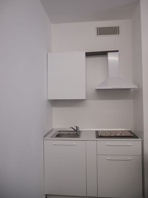 Junior Suite | Private kitchen | Mini-fridge, highchair