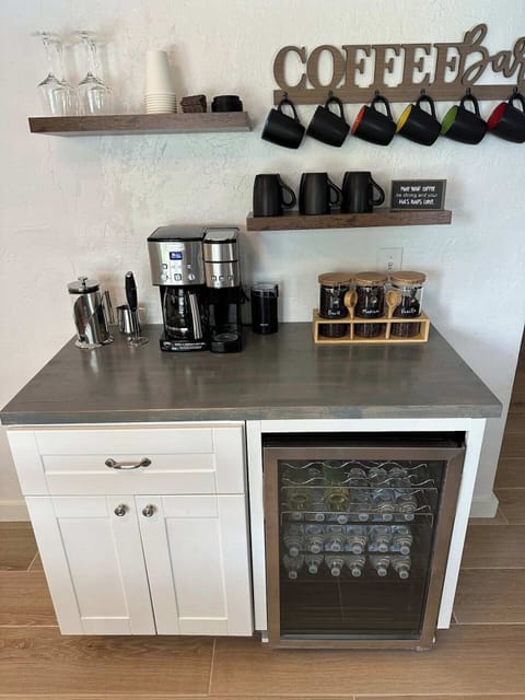 Coffee Bar comes with a full size coffee pot, k cup, ground coffee, beans, cold brew, French Press, a frothier, and amazing to go cups.