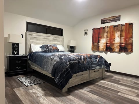 Upstairs bedroom "horse decor". With TV & fireplace