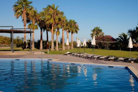 Indoor pool, outdoor pool, pool umbrellas, sun loungers