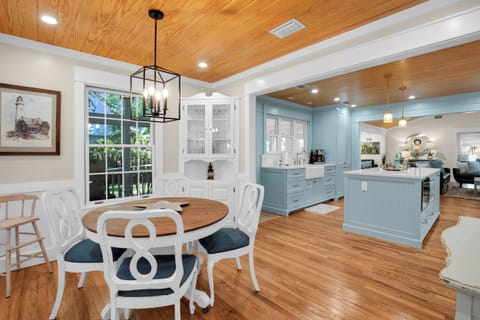 The kitchen has additional seating for 4