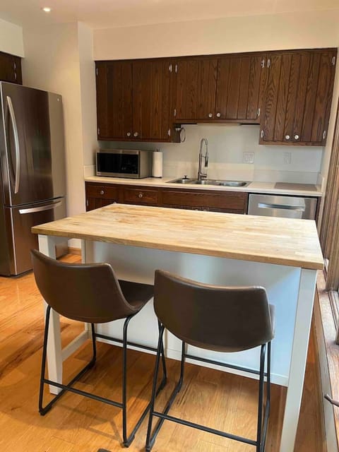 Fully equipped kitchen with island and modern appliances