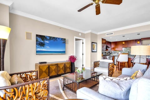 Living room blends comfort and space with direct access to the lanai and open dining nearby. HKK-825