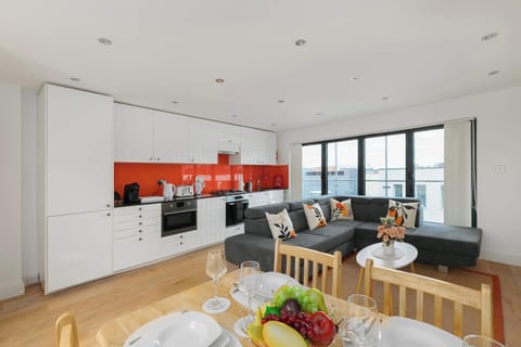Bright open-plan living, kitchen and dining area, beautifully designed with abundant natural light to create a warm and inviting space for relaxing, cooking and spending time together.