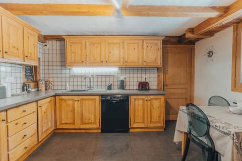 The kitchen has a small dining table