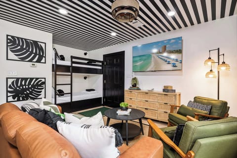 Stylish space with vibrant decor, bunks for fun, and a perfect spot to unwind!