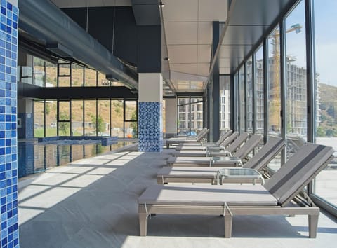 Indoor pool, seasonal outdoor pool, pool umbrellas, sun loungers