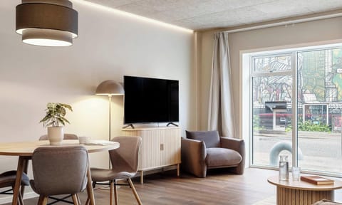 Room view with natural light and both blackout curtains and a thin layer of curtains, to ensure your privacy