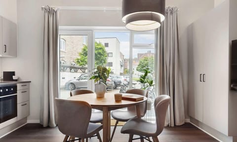 Room view with natural light and both blackout curtains and a thin layer of curtains, to ensure your privacy