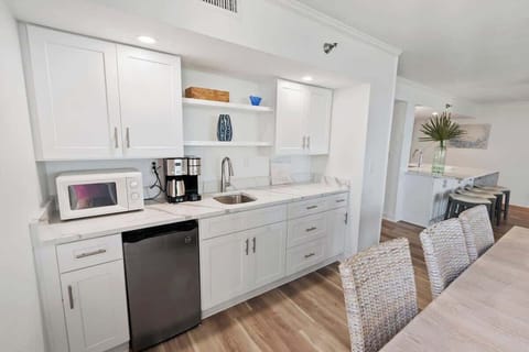 Wetbar with mini fridge and double coffee maker.  You can use K-cups or make pot coffee.  Lots of storage for extra food.  