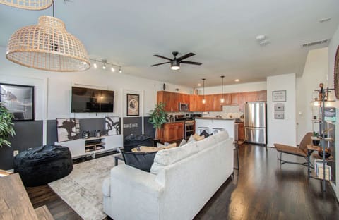 Featuring an open-concept layout that makes it easy to socialize with those in the kitchen, this living room was designed with your comfort in mind!