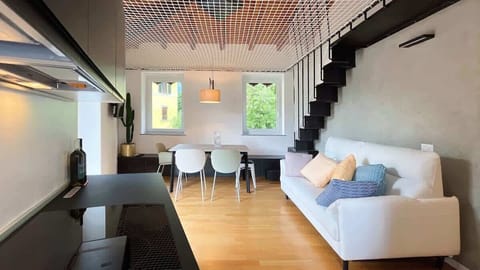 cozy and bright environment that joins living room and kitchen, with also a staircase that leads to the web which dominate the living room