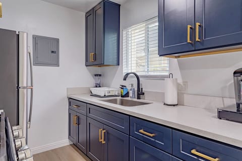 Fully stocked kitchen w/ sink and cabinets where you'll fine what you need.